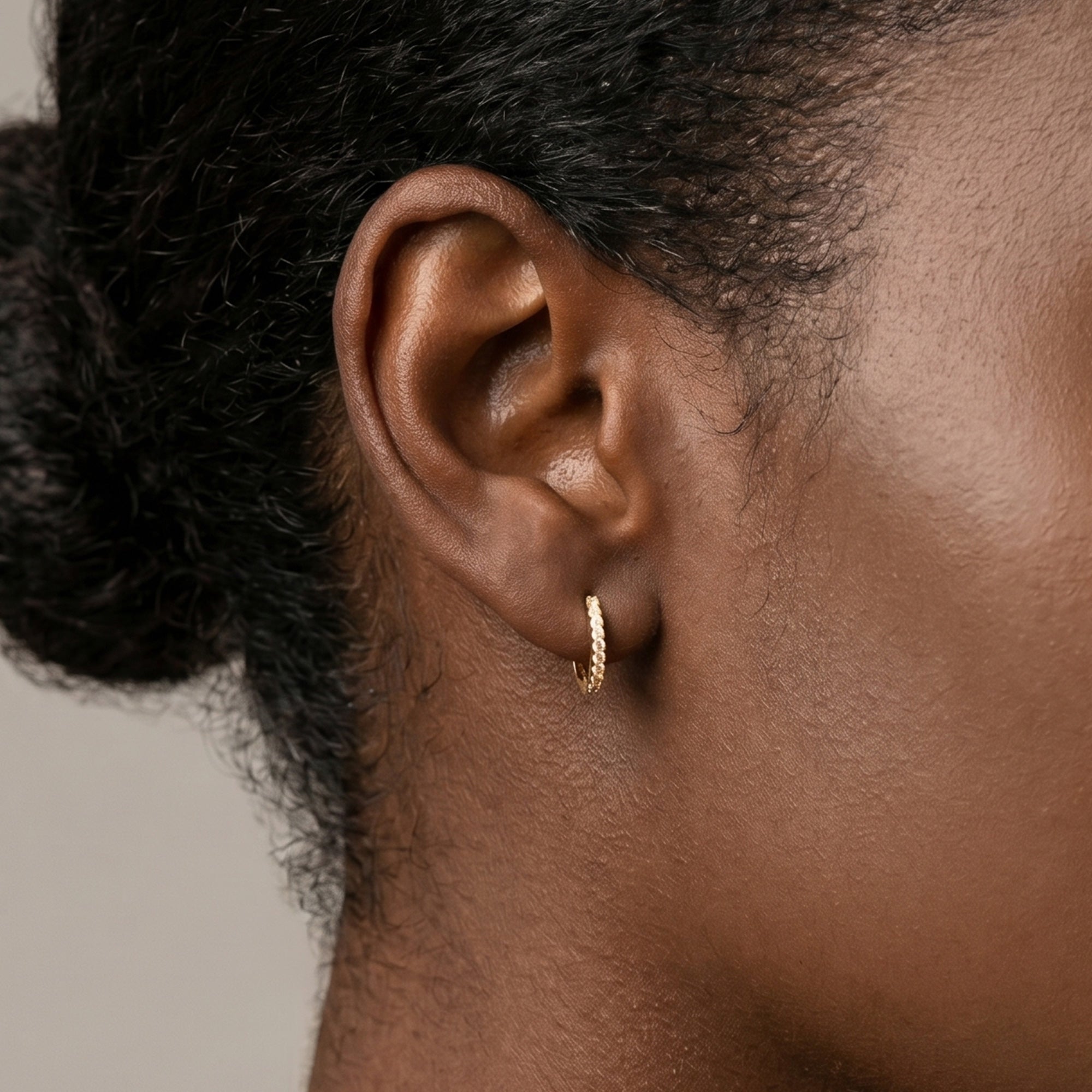 Arel Custom Jewelry 14k solid white gold huggie hoop earrings featuring pave set diamonds, measuring 8mm inner diameter and 11mm outer diameter.