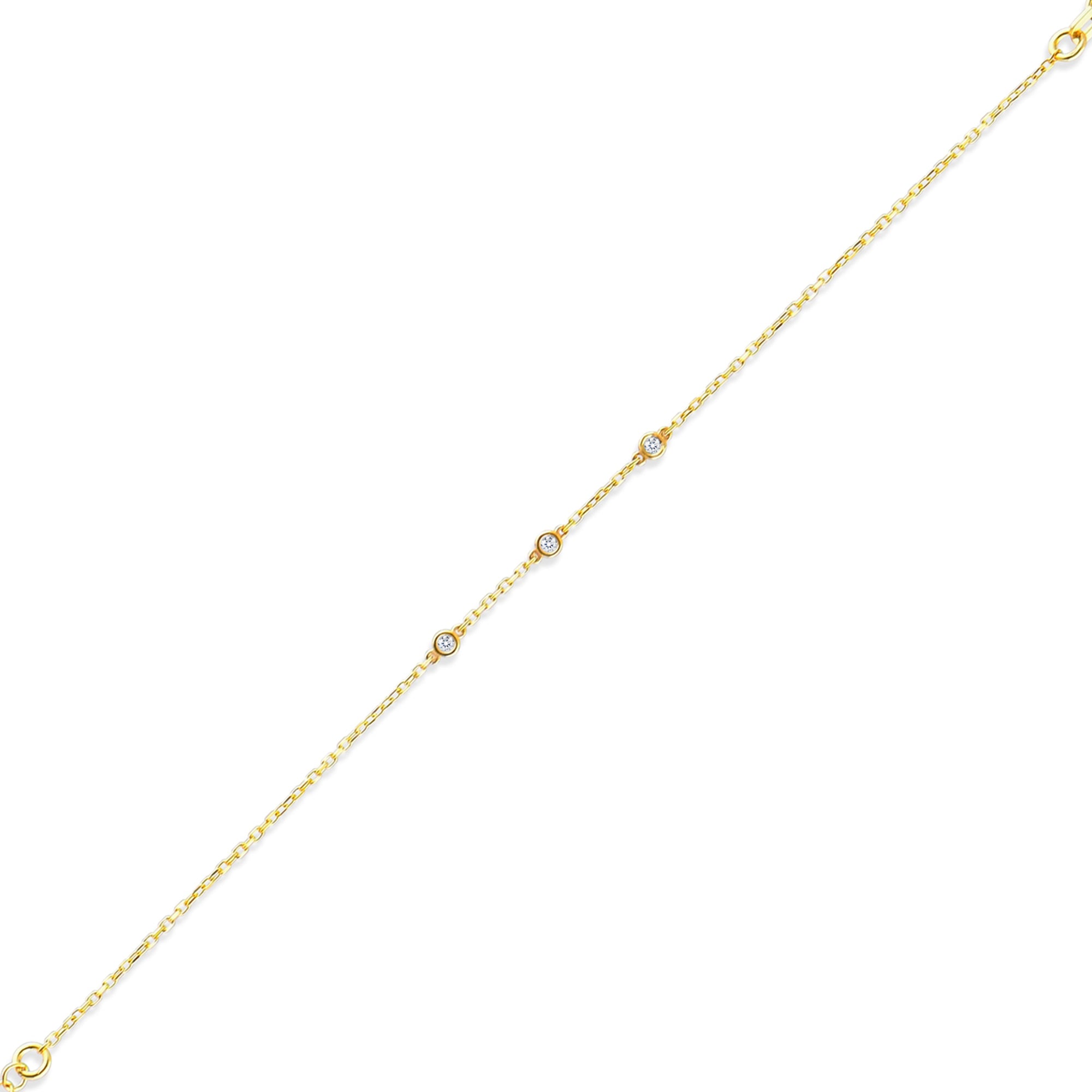 Arel Custom Jewelry 14k solid gold dainty station bracelet featuring three bezel set natural diamonds on a model's wrist