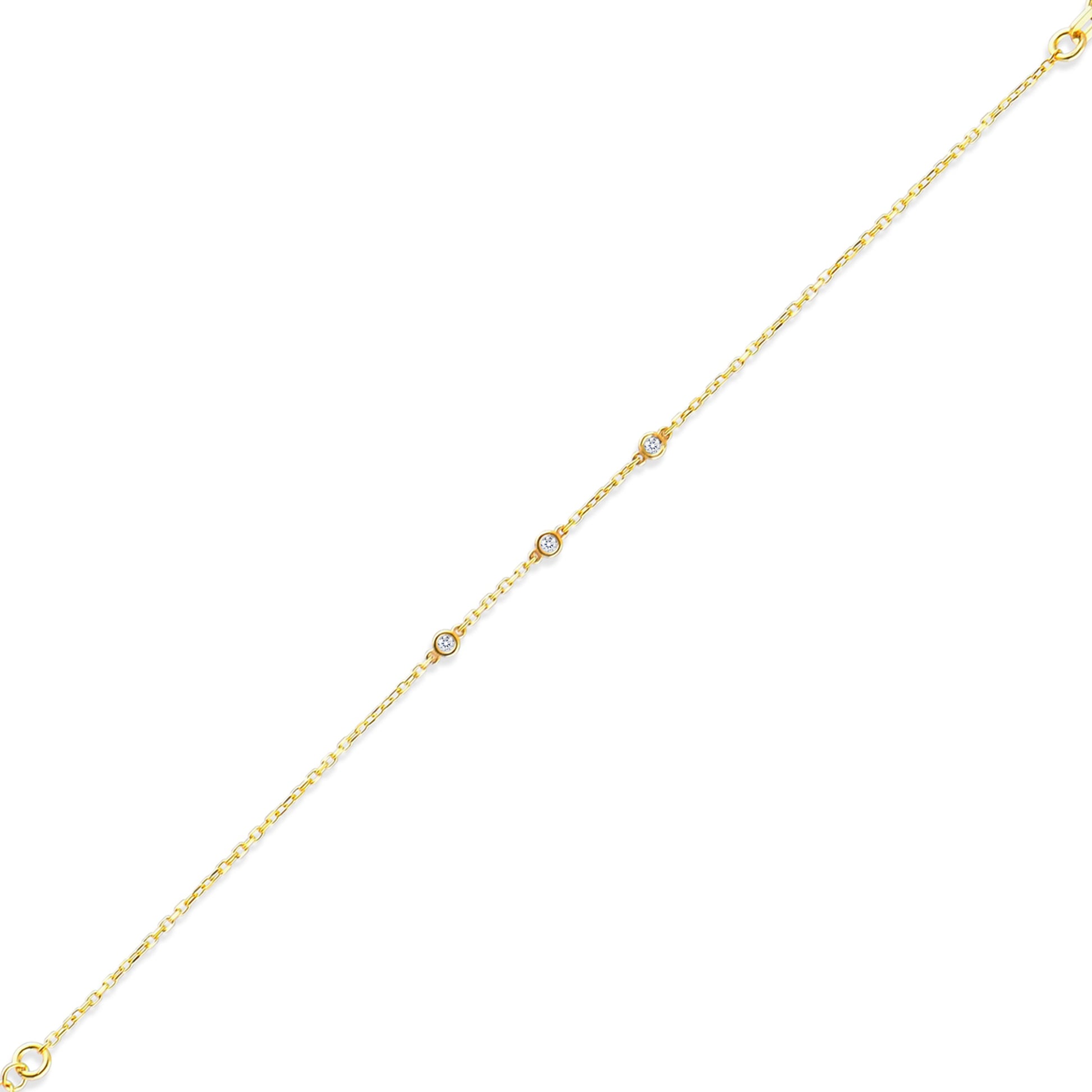 Arel Custom Jewelry 14k solid gold dainty station bracelet featuring three bezel set natural diamonds on a model's wrist