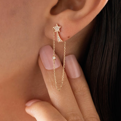 Arel Custom Jewelry 14k solid gold North Star earring with natural diamonds and a shooting star tail on model.