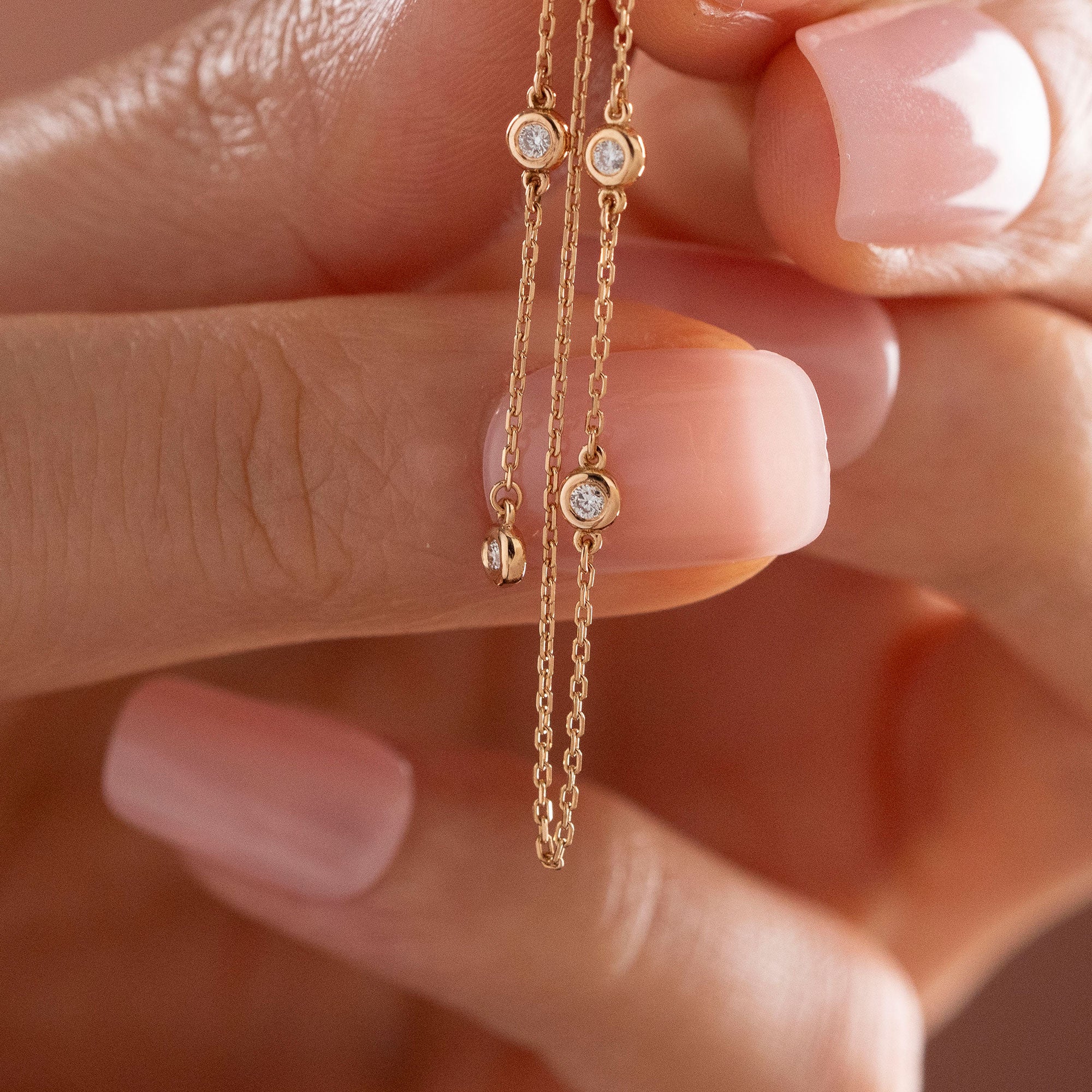 Arel Custom Jewelry 14k solid gold flower earrings with natural diamond accents and dangling chains