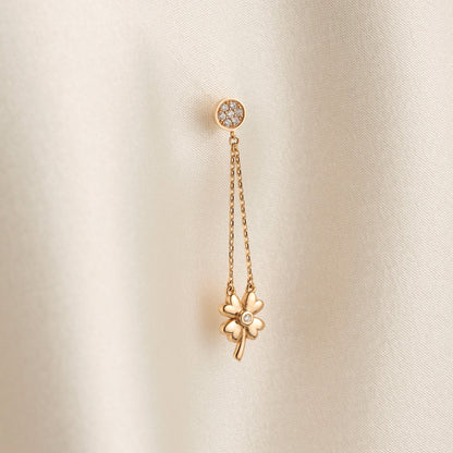 Arel Custom Jewelry 14k solid gold dangle earring with a pave diamond stud and double chain clover drop on a model.
