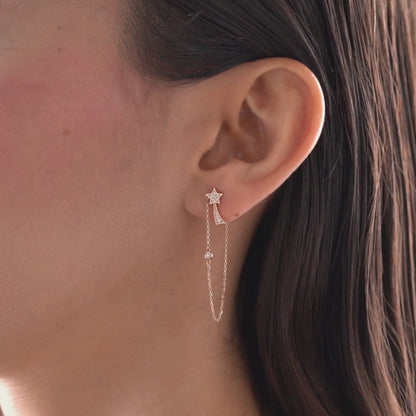 Arel Custom Jewelry 14k solid gold North Star earring with natural diamonds and a shooting star tail on model.